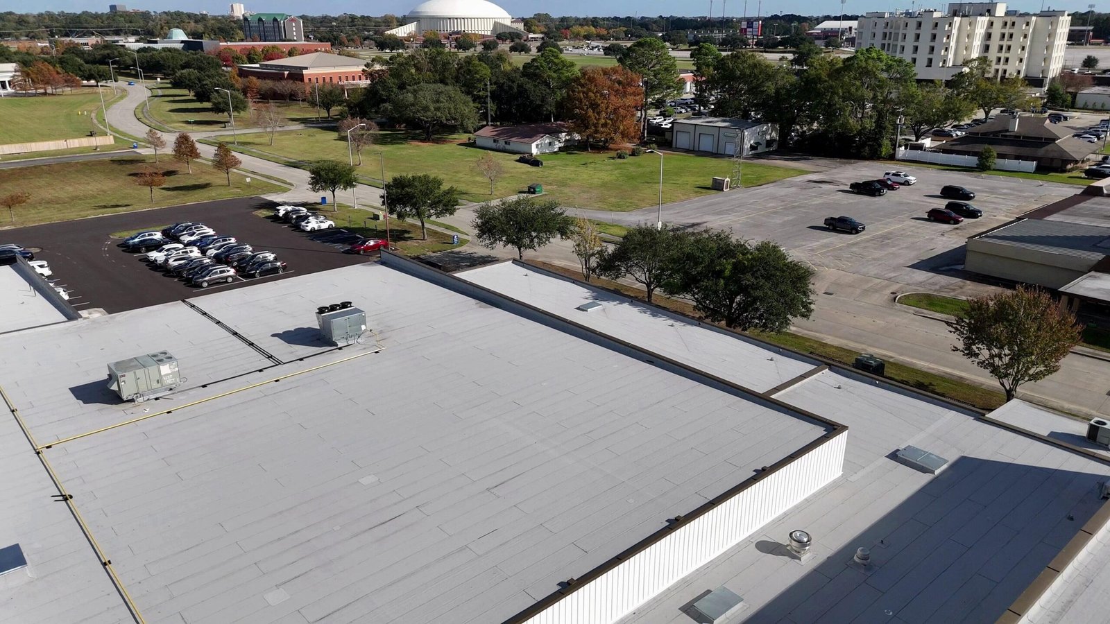 Commercial roofing crew at work on a Louisiana roof